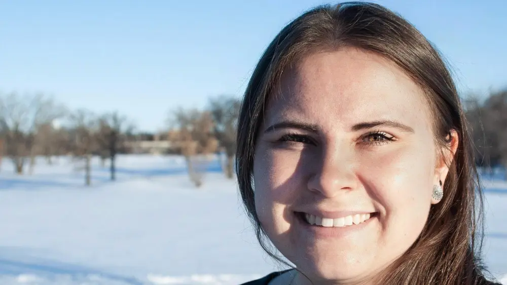 a woman standing in snow