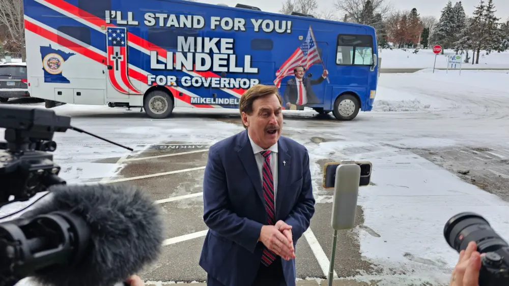 a man in front of a bus
