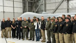 Homeland Security Secretary Kristi Noem with Border Patrol agents at Grand Forks Air Force Base