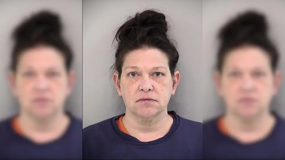 a woman in a mugshot