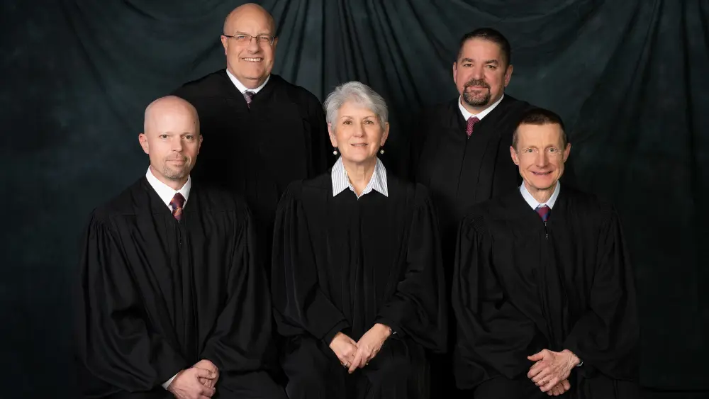 men and women in black robes