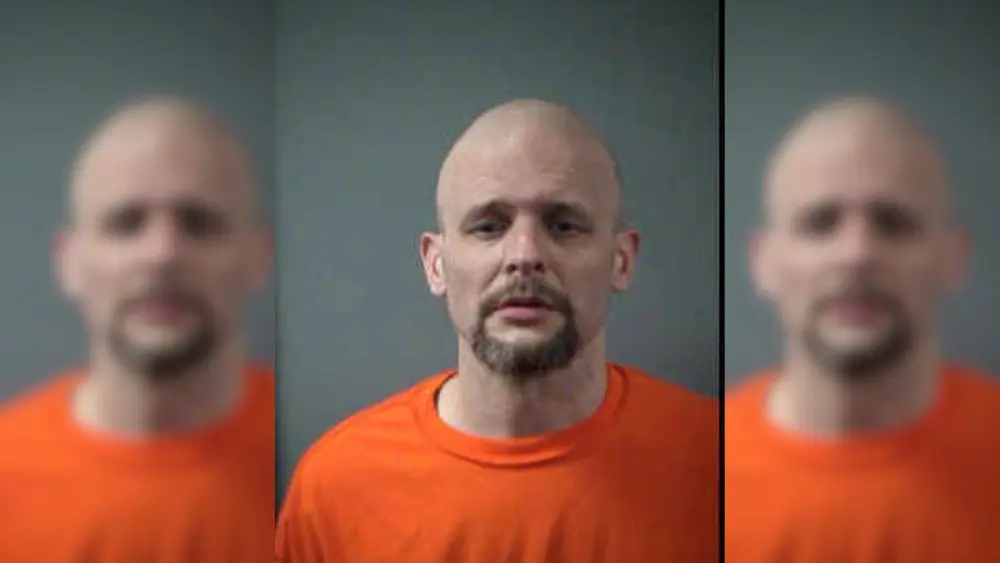 a man in an orange shirt