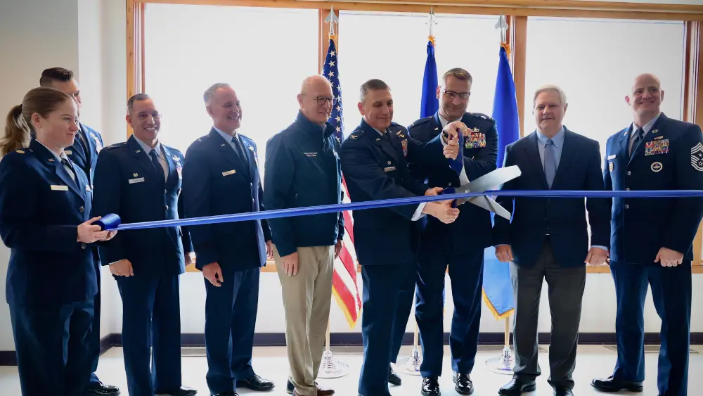 officials participate in a ribbon cutting ceremony
