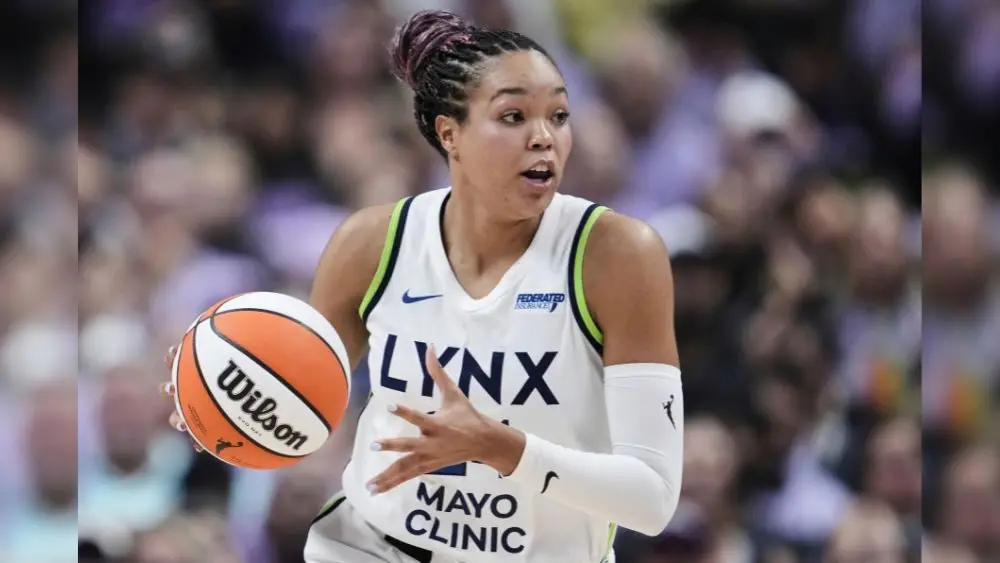 Napheesa Collier dribbling a basketball