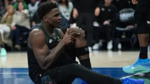 Anthony Edwards sitting on the court