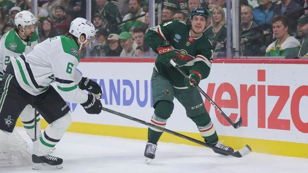 Minnesota Wild center Joel Eriksson Ek shooting a hockey puck