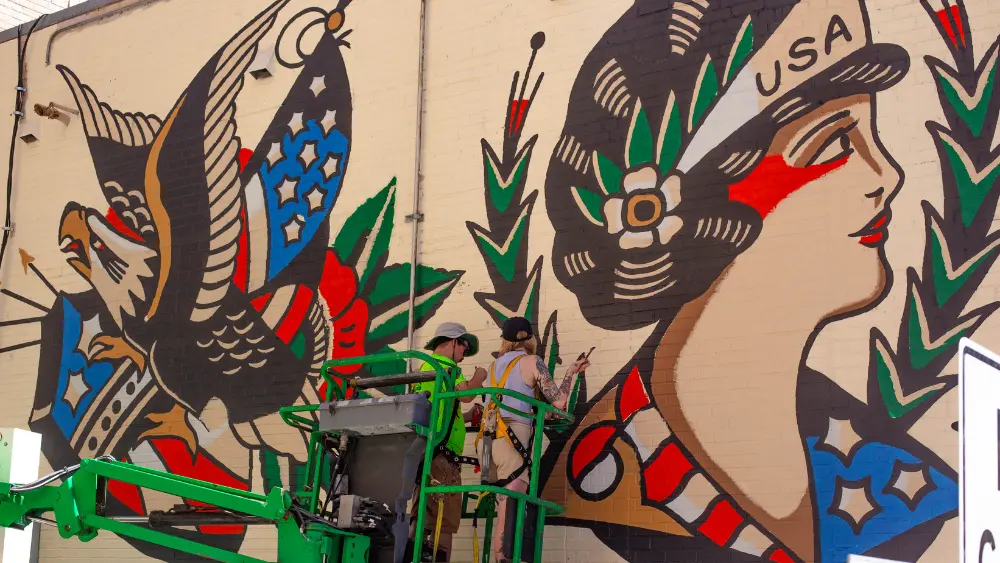 a worker with a mural