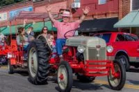 pat-red-checks-on-tractor-e1694700109309