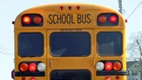 school-bus-with-flashing-lights-on-a-country-road