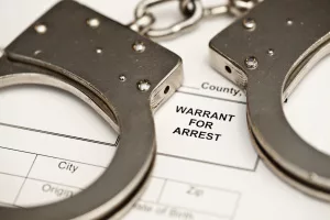 handcuffs-on-a-warrant-for-arrest-2