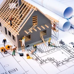 building-house-on-blueprints-with-worker-construction-project