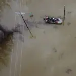 REMC Crews Restore Power After Storm; Sheriff Assists with Boat in Flooded Area