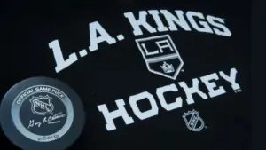 Official NHL game puck with LA kings equipment ^ product shot