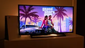 PlayStation 5. New Grand Theft Auto VI Sony PS5 console. Dualsense controller. Man holding joystick and ready to play upcoming GTA 6 game