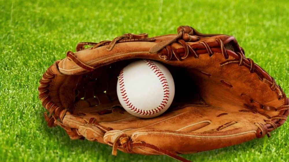 Baseball glove with a ball