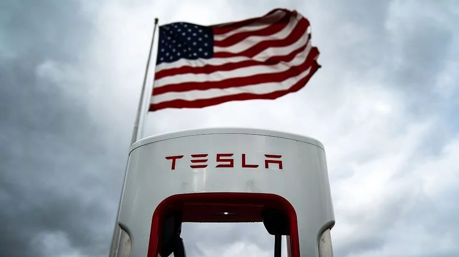 tesla-charger-with-flag759371