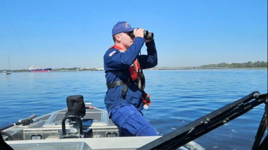 coast-guard-member-searching10658