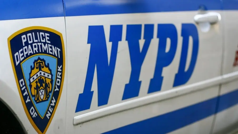 Side door closeup of Nypd police patrol car are patrolling parked near the curb. New York november 2020