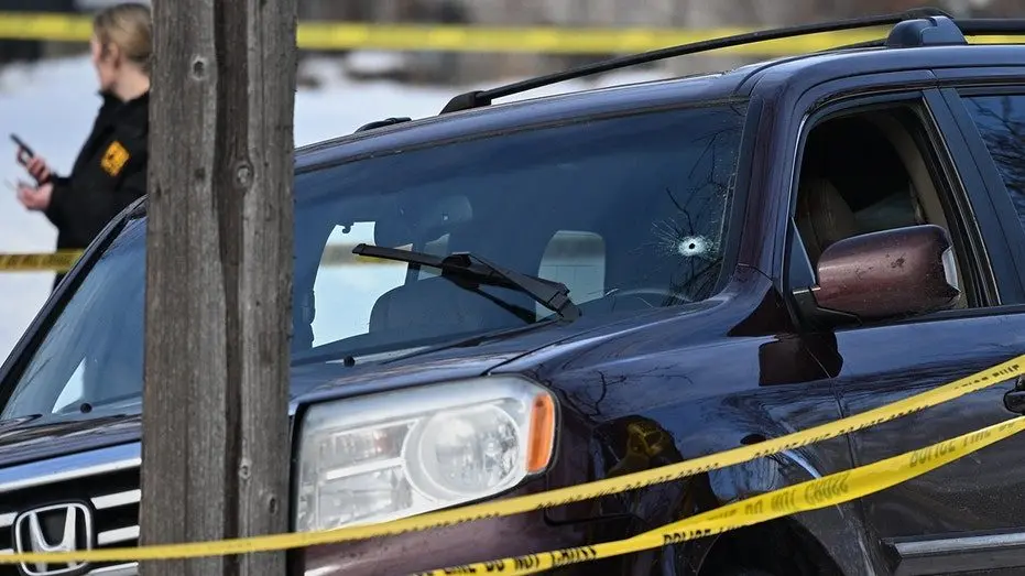 ice-shooting-minnesota-bullet-hole-car-scene197601