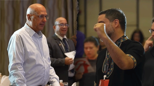 conference-attendees-shanghai-raise-fists-communist-anthem-neville-roy-singham569427