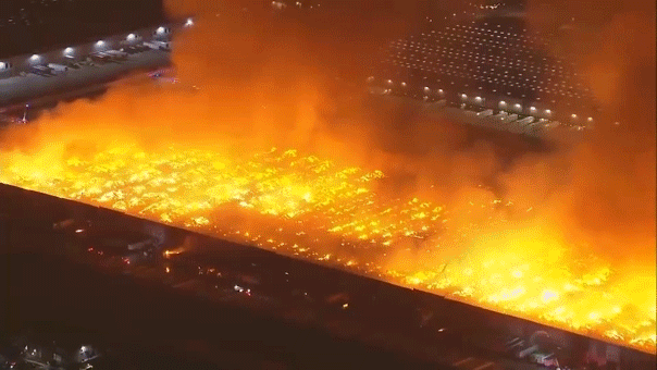Massive six-alarm blaze engulfs California warehouse, employee detained