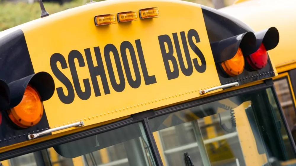 schoolbuschildreneducationaltransportsittingintheparkinglot-2