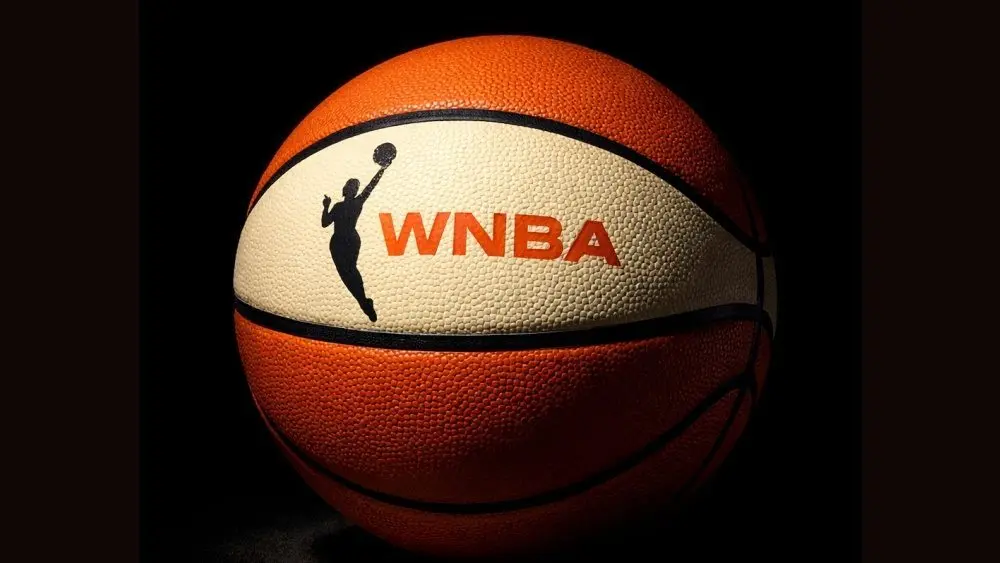 AI Generated photo featuring basketball with the WNBA logo^ background is completely black with ball illuminated artistically. (This content was generated by an Artificial Intelligence (AI) system.)