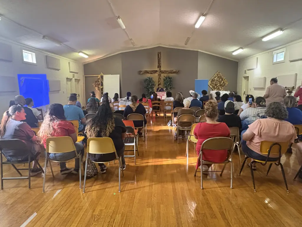 Parents and community members gathered for the graduation ceremony held at Challenge House 7. 