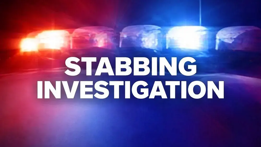 stabbing-investigation-under-police-lights-jpg