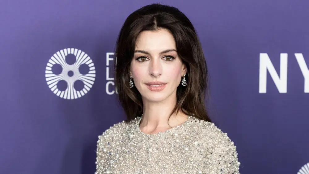 Anne Hathaway wearing dress and shoes by Valentino attends presentation of movie Armageddon Time during 60th New York Film Festival at Alice Tully Hall on October 12^ 2022