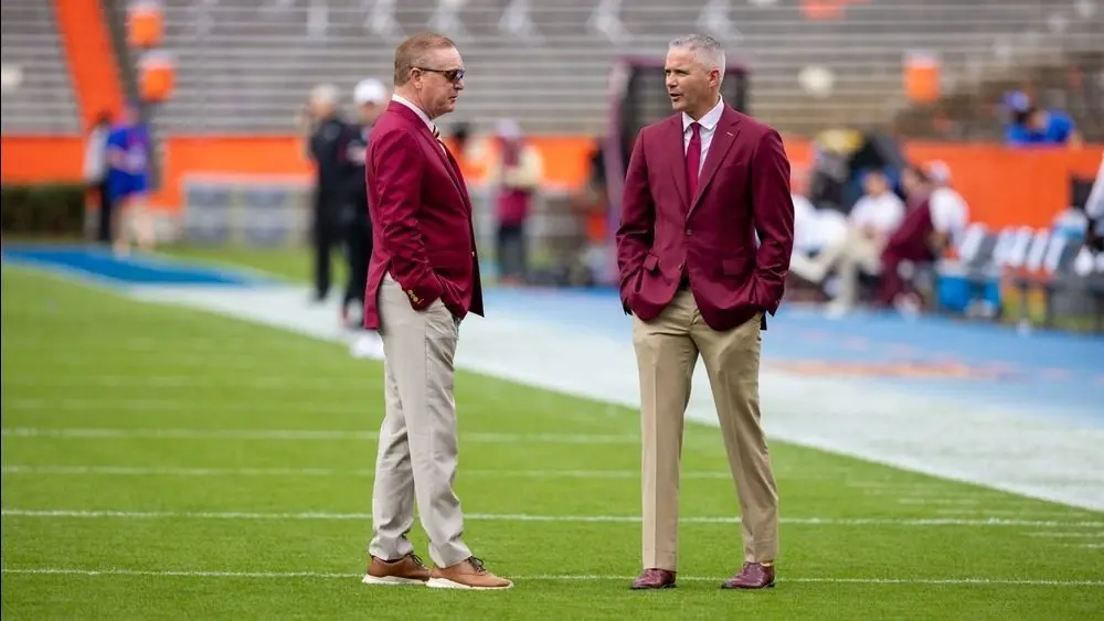 Florida State Seminoles head coach Mike Norvell Florida State Seminoles Athletic Director Michael Alford at Ben Hill Griffin Stadium. Gainesville^ Florida USA - November 29^ 2025