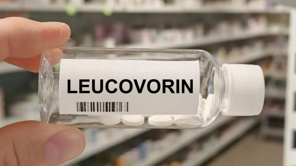 Bottle of LEUCOVORIN tablets on a hospital pharmacy table used to reduce methotrexate toxicity a folinic acid supplement.