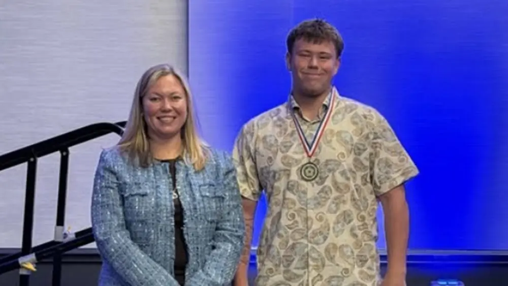 04-27-26-jayden-travis-tom-leach-team-resilient-award-feature