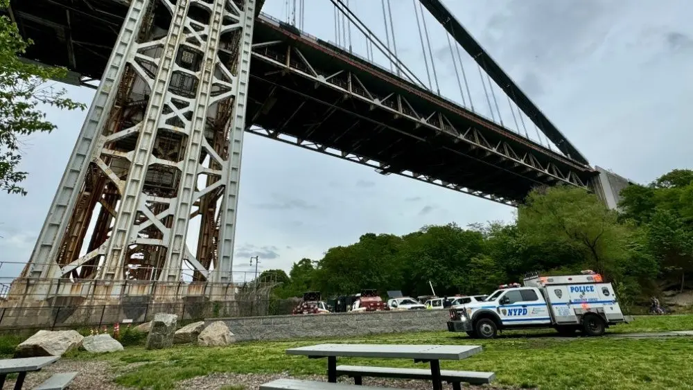 NYPD Police truck responding to a person who has climbed up the George Washington Bridge in Fort Washington Park New York^ NY USA - May 18^ 2024