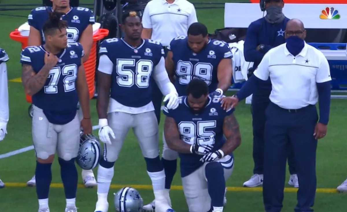 dontari-poe-kneel