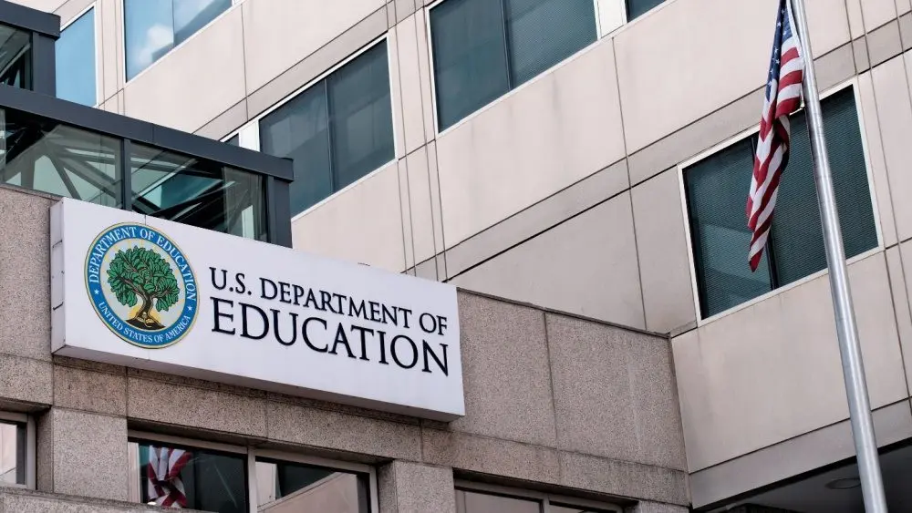 The exterior sign and US flag in front of the U.S. Department of Education offices in Washington^ DC. Washington^ DC USA; September 5^ 2024