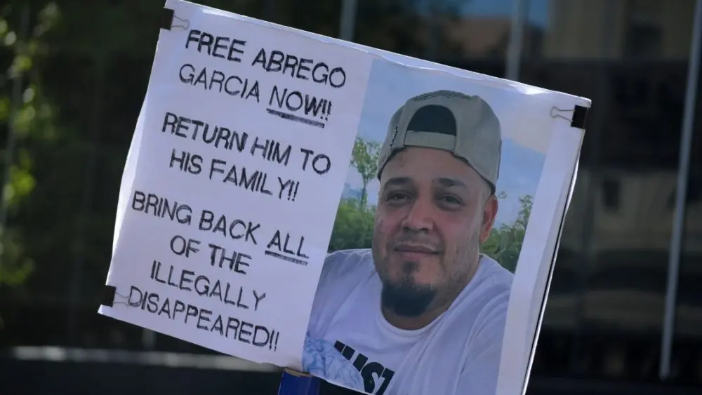 protest sign reading: "Free Abrego Garcia Now" Return Him To his family! Bring back all of the illegally disappeared! NEW YORK^ NEW YORK USA - May 1^ 2025 on International Workers' Day in Lower Manhattan.