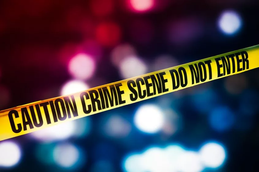crime-scene-tape-with-red-and-blue-lights-on-the-background