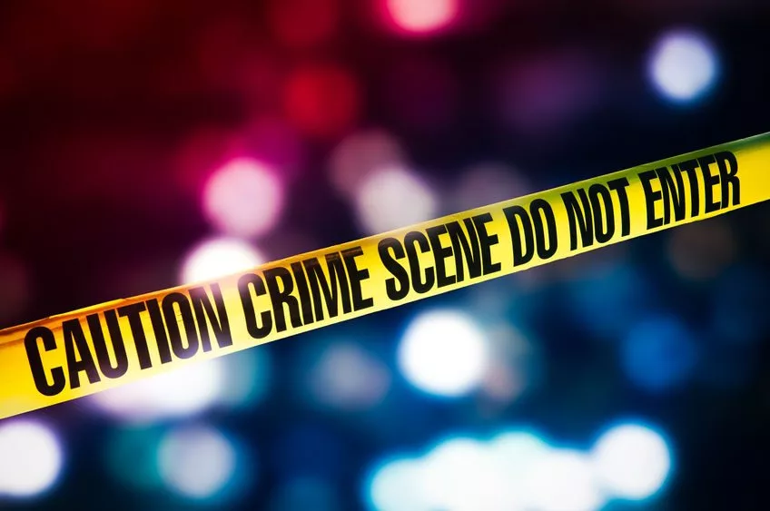 crime-scene-tape-with-red-and-blue-lights-on-the-background