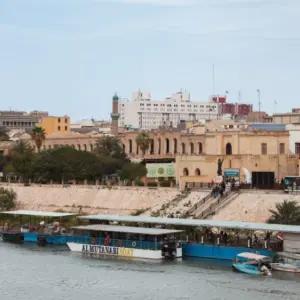 Historic buildings and riverboats on the Tigris River in Baghdad^ Iraq Baghdad^ Iraq - March 22^ 2025