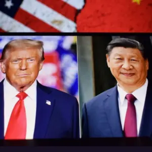 Photos of U.S. President Donald Trump and President of the People's Republic of China Xi Jinping appear on a smartphone screen. 11.04.2025. New York^ USA.
