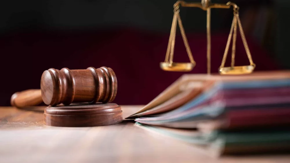 focus-on-hammer-group-of-files-on-judge-table-covered-with-dust-concept-of-pending-old-cases-or-work-at-judicial-court-7
