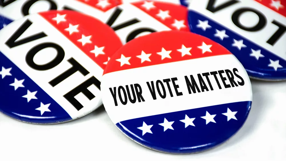 collection-of-election-campaign-vote-pins-on-white