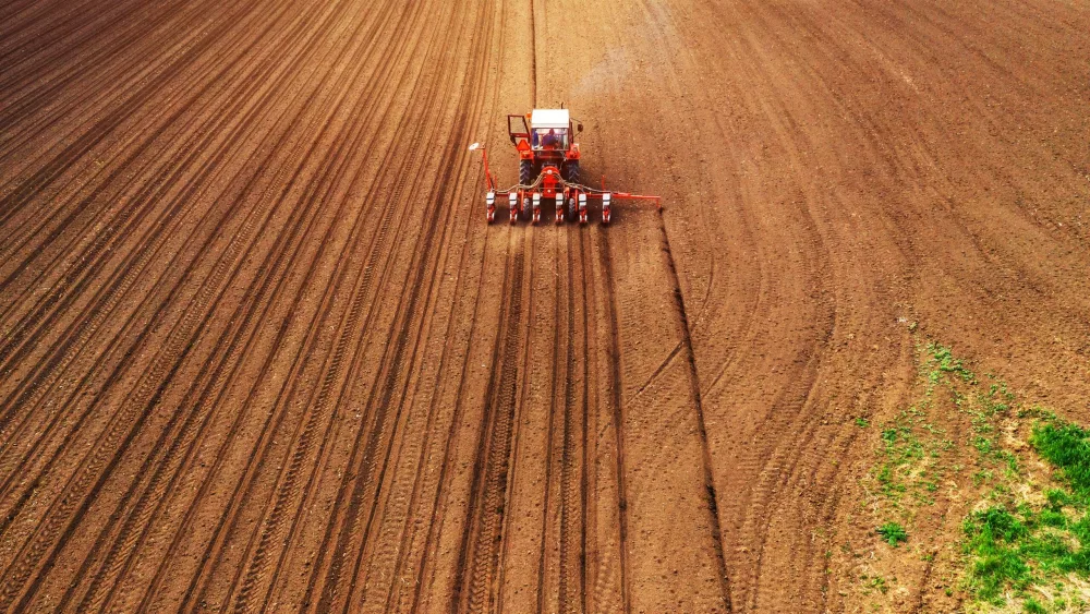 aerial-view-of-tractor-with-mounted-seeder-performing-direct-seeding-3