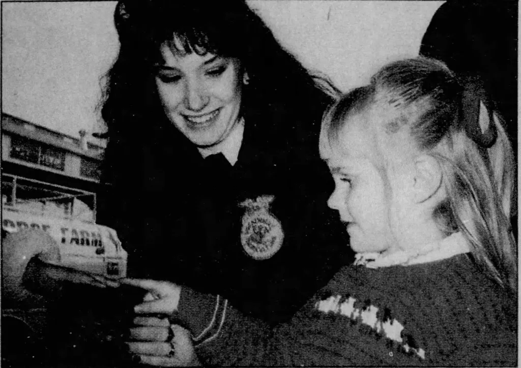 Brooke Rollins as an FFA member, holding a show rabbit for a child at the 1990 Fort Worth Stock Show.