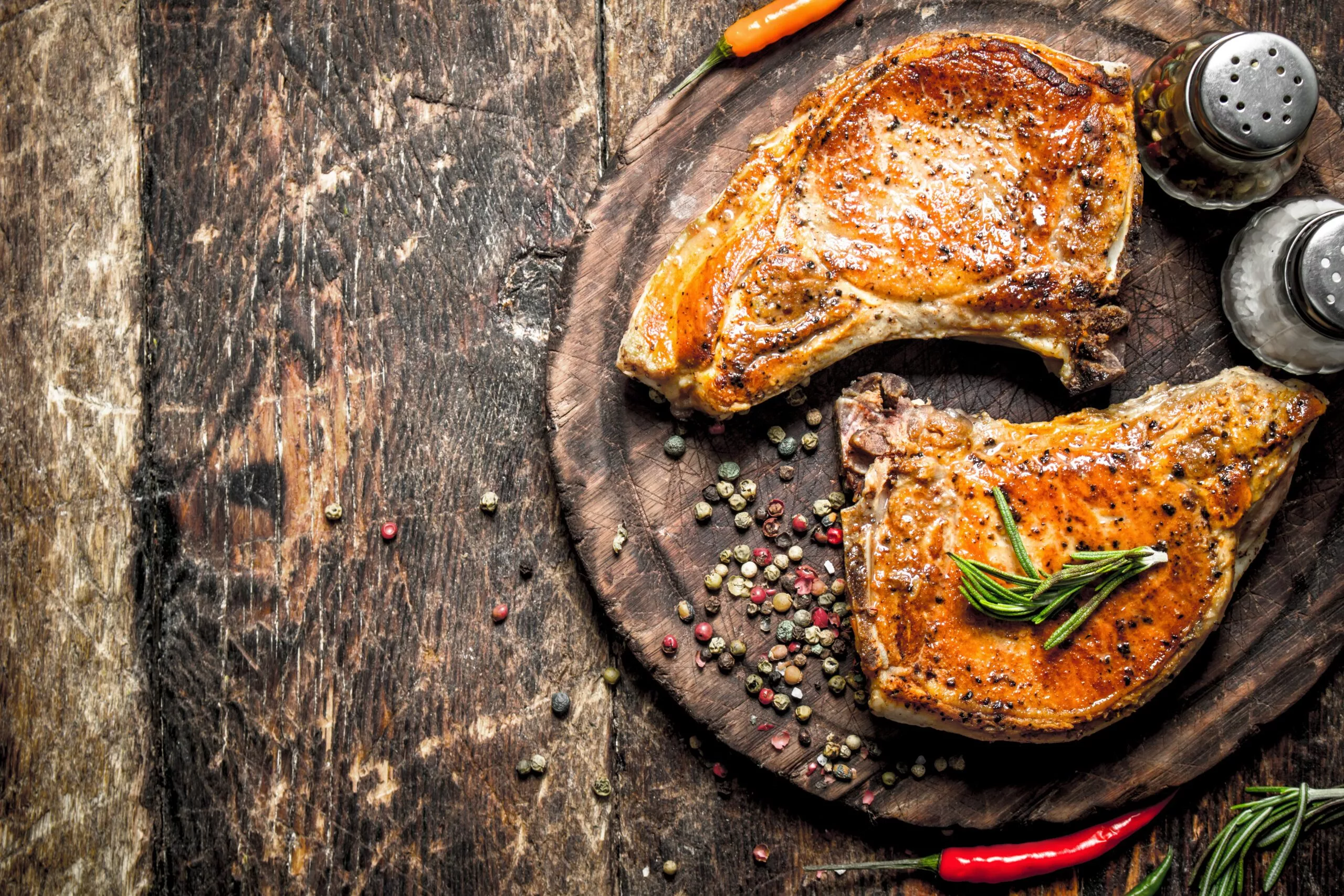 Grilled pork on a cutting Board. On a wooden table.