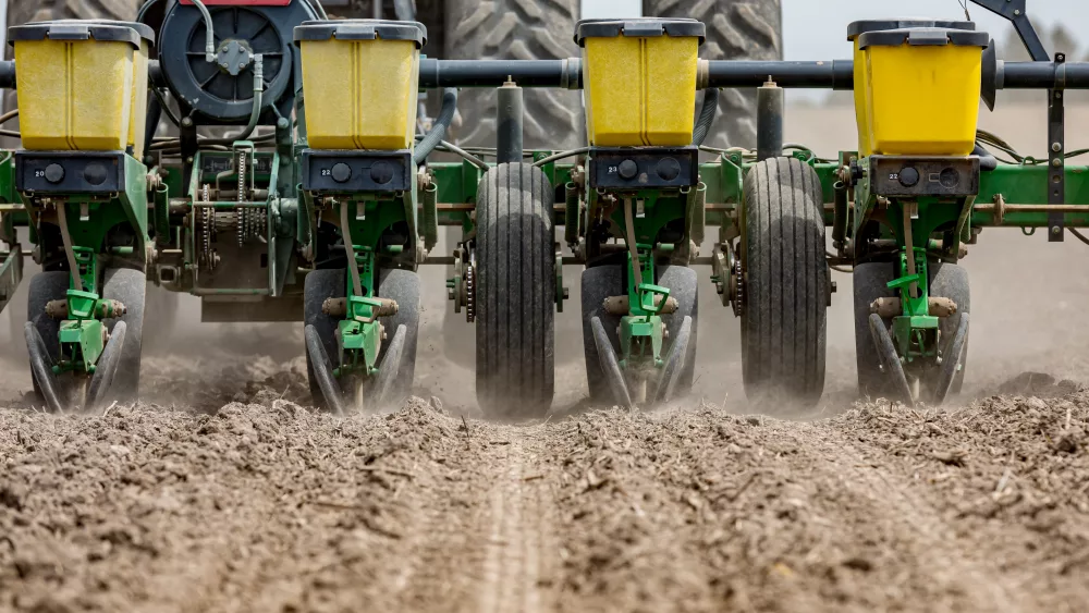 closeup-of-tractor-and-planter-in-farm-field-planting-corn-or-so