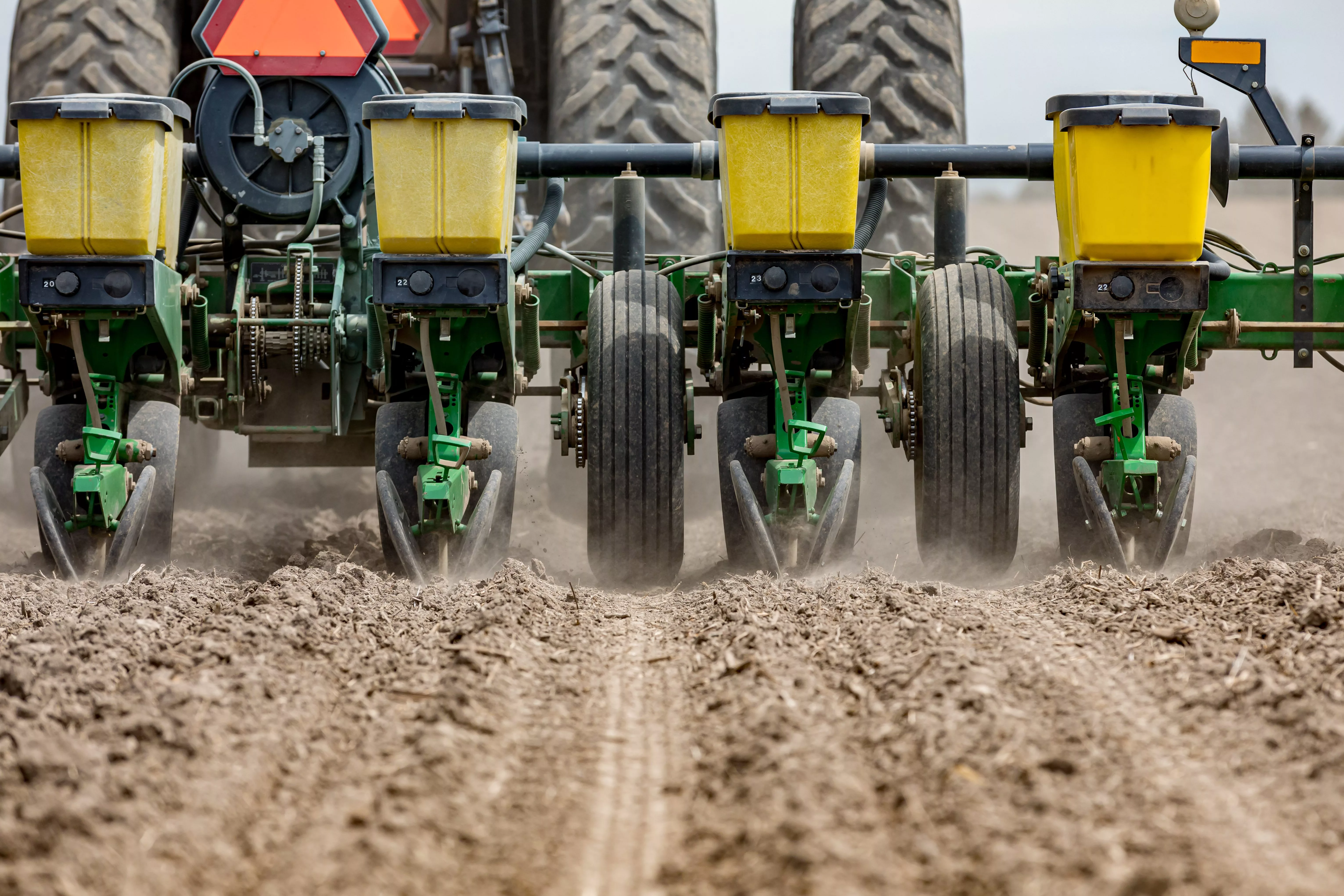 closeup-of-tractor-and-planter-in-farm-field-planting-corn-or-so