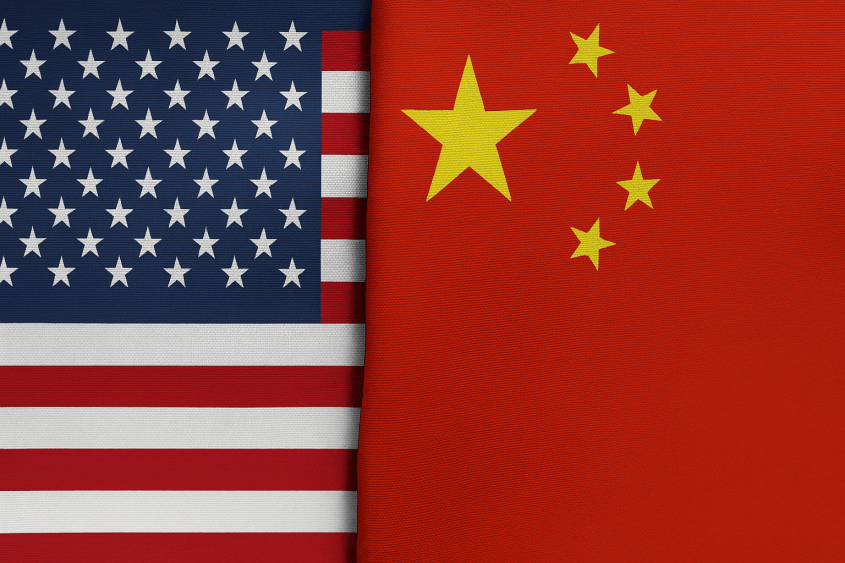 A high-resolution image showing the national flags of the United States and China placed side by side^ separated by a visible fabric crease down the middle.