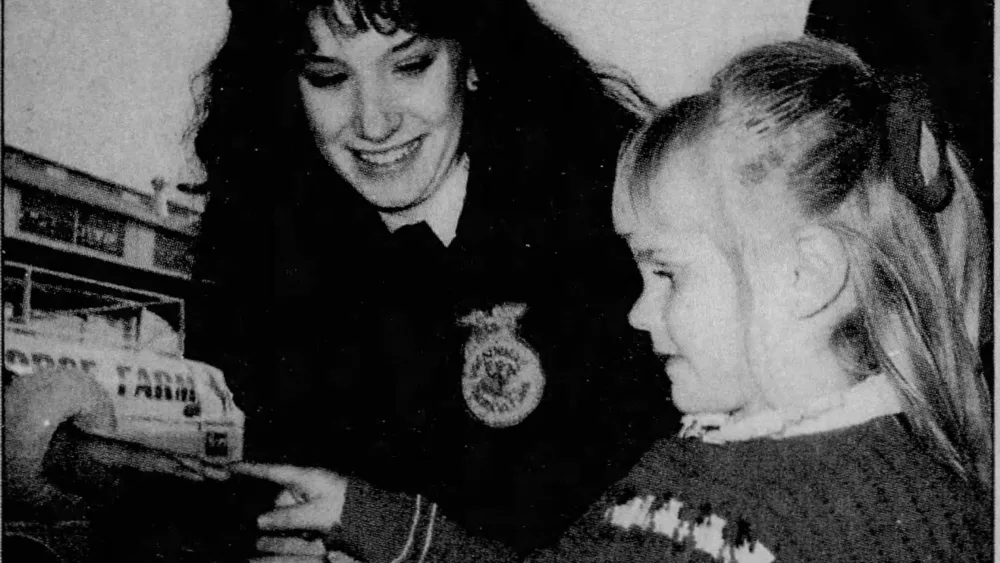 Brooke Rollins as an FFA member, holding a show rabbit for a child at the 1990 Fort Worth Stock Show.